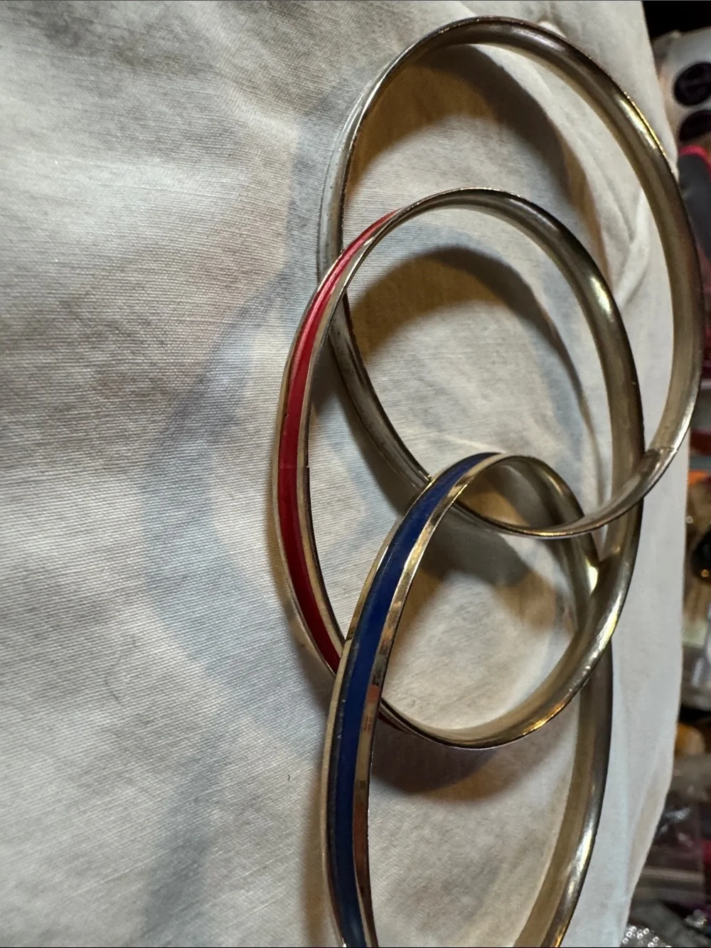 Napier Interlocked Goldtone Bangles with Red, White, and Blue Enamel Accents